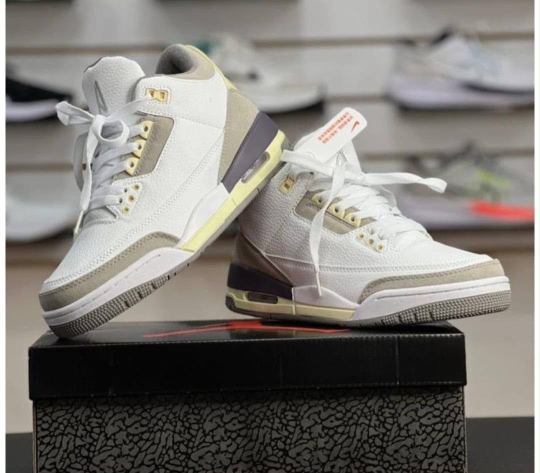 White high-top sneakers on a box